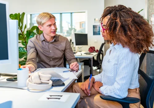 colleagues-discussing-business-strategy-in-coworki-2025-07-19-22-20-16-utc